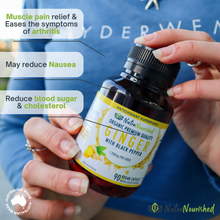 Load image into Gallery viewer, Bottle of NutraNourished ginger with black pepper capsules held by a person, with text highlighting health benefits.
