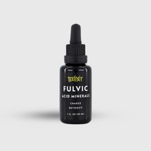 Load image into Gallery viewer, Black bottle of Teelixir Fulvic Acid Minerals on a light gray background
